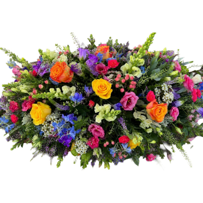 A Life in Colour Casket Spray - A striking casket spray bursting with bright, colourful tones and fresh greenery, creating a beautiful and uplifting floral tribute.