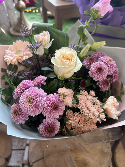 Pink Harmony - A charming bouquet of soft pink, peach and cream blooms, beautifully complemented by fresh greenery.