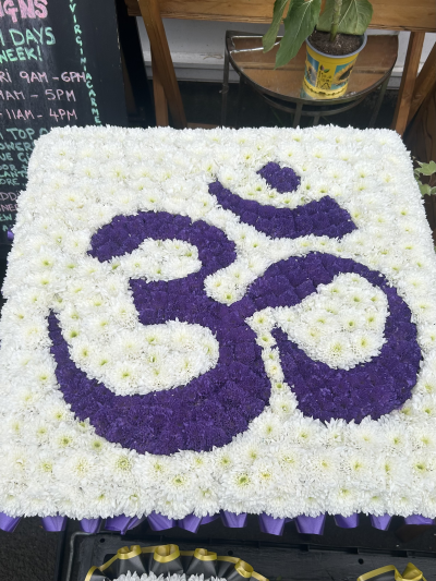'Om' symbol funeral tribute - A meaningful Om symbol floral tribute, handcrafted with care by Virginia Carmen Designs in Bolton.